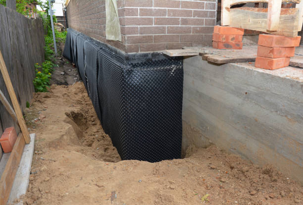 Happy homeowners after waterproofing job in Bridgman